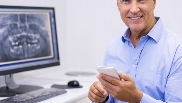 A dentist using the OrthoPhoto app